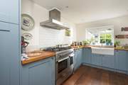 This kitchen is adjacent to the dining-area, giving a social vibe.