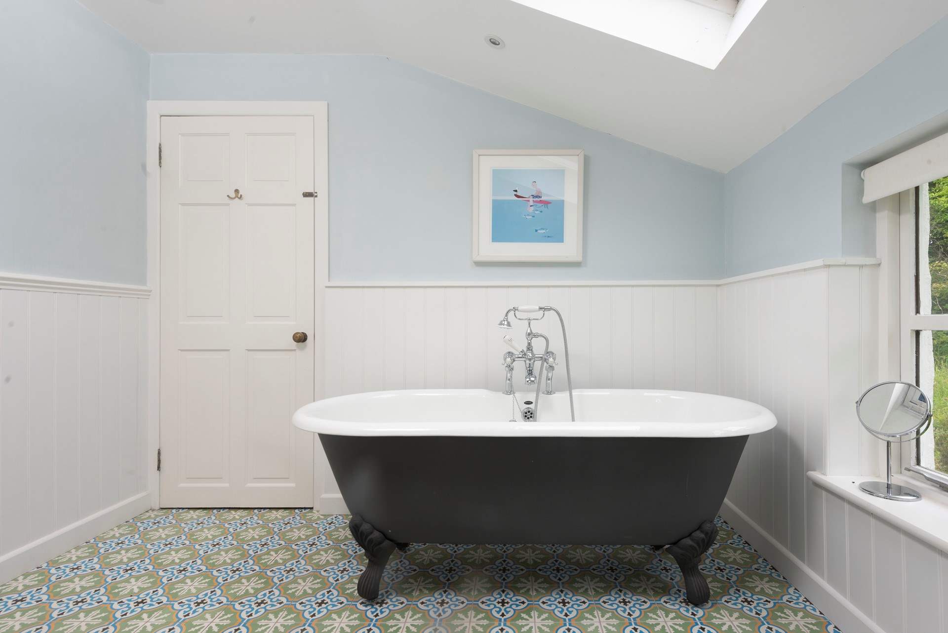 Soak away the stresses of everyday life in the large roll top tub.