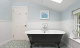 Soak away the stresses of everyday life in the large roll top tub. - Thumbnail Image