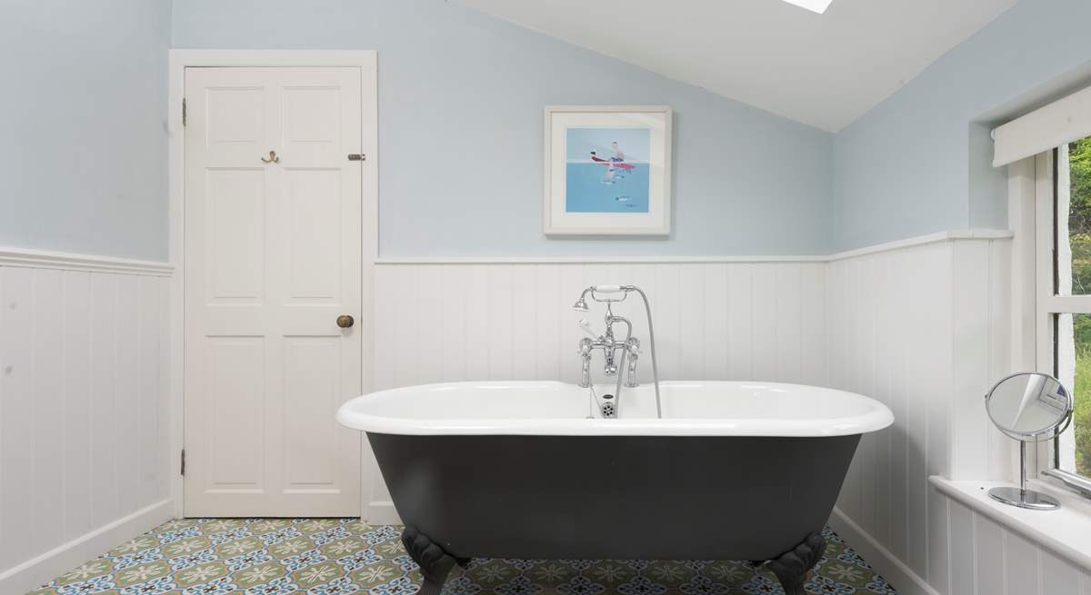 Soak away the stresses of everyday life in the large roll top tub.