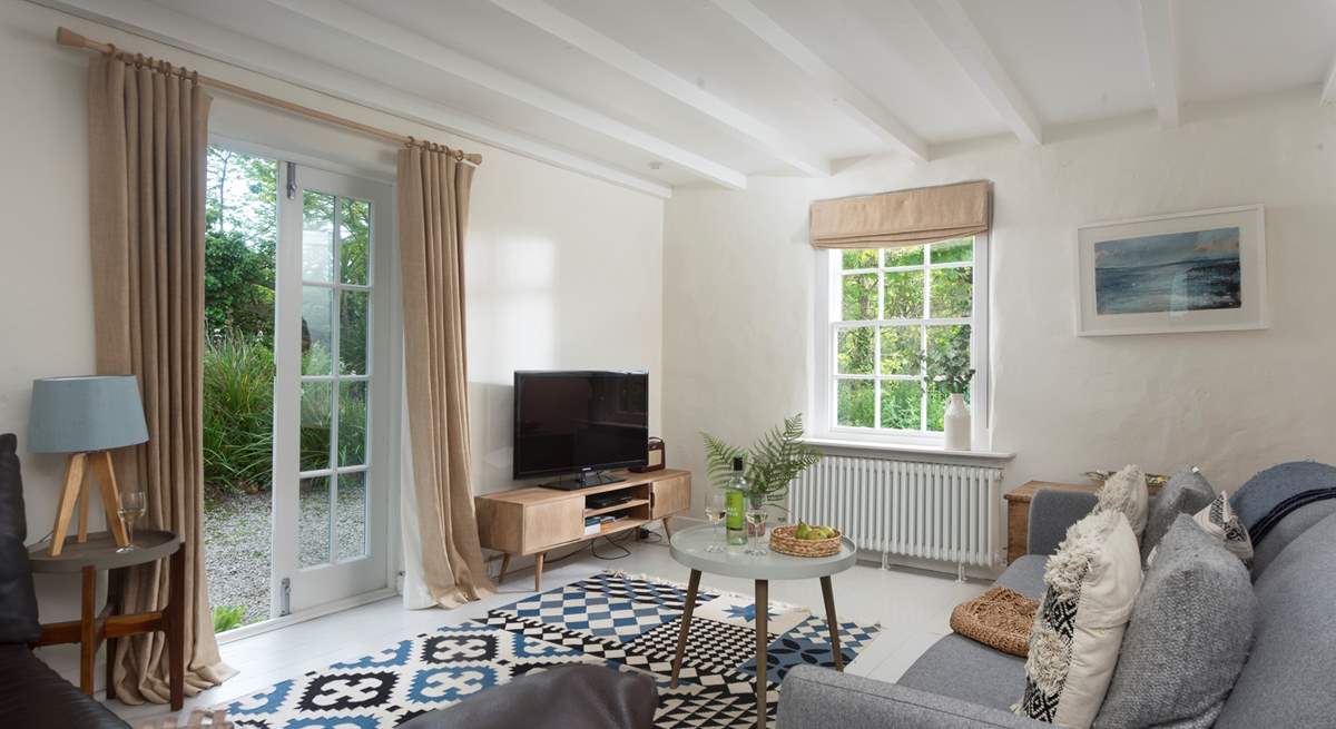 This gorgeous sitting-room  is one of 3 and has double doors to access the beautiful grounds.