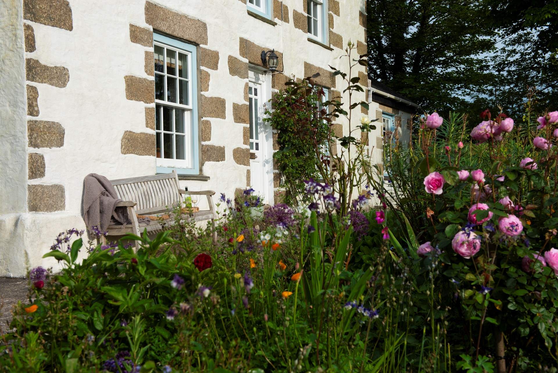 The front elevation comes alive in Spring with flowers.