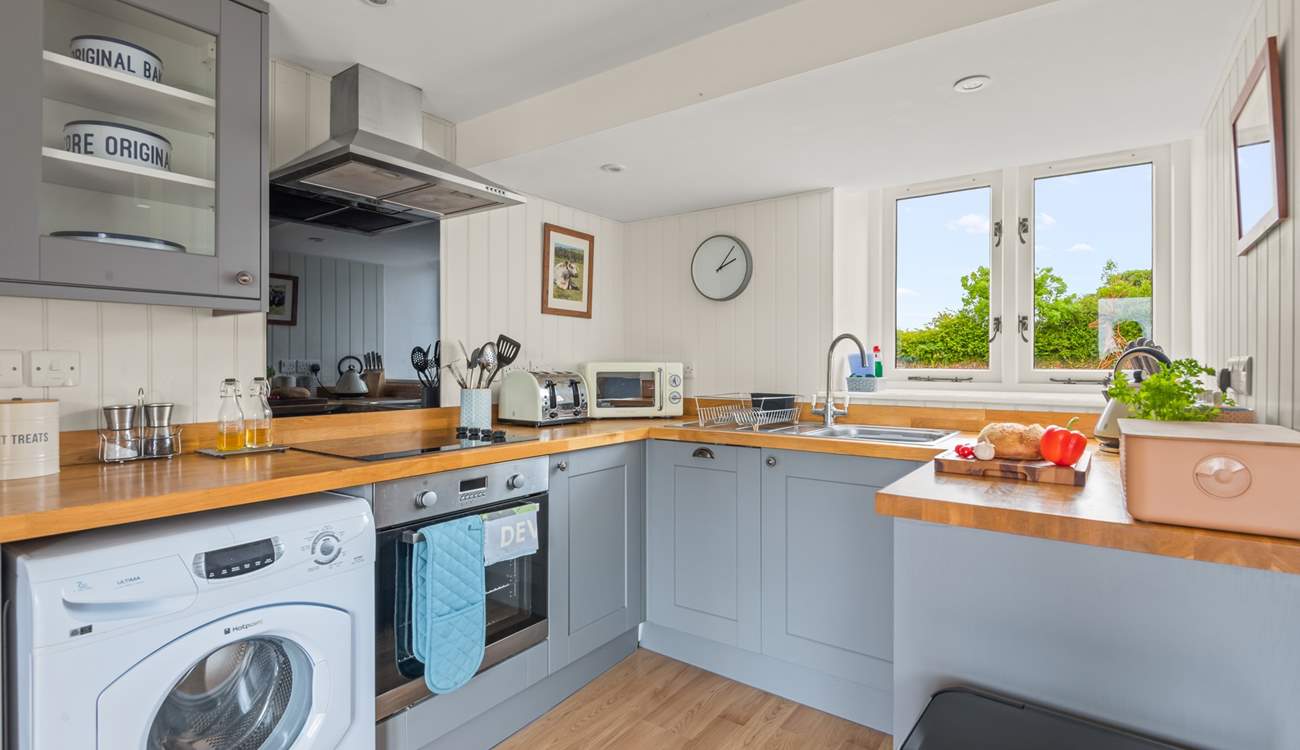 Back in the house, the kitchen is fully equipped with everything you will need to whip up that special meal.