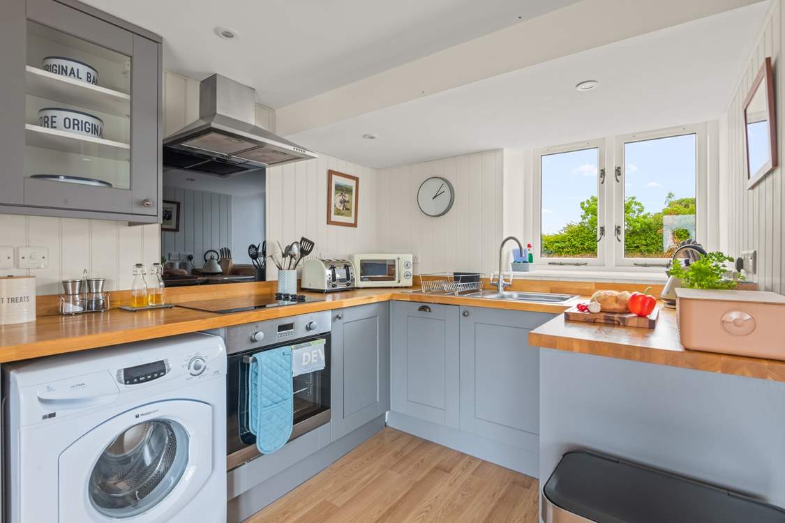 Back in the house, the kitchen is fully equipped with everything you will need to whip up that special meal.