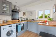Back in the house, the kitchen is fully equipped with everything you will need to whip up that special meal.