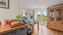 The kitchen and dining areas open out onto your patio.