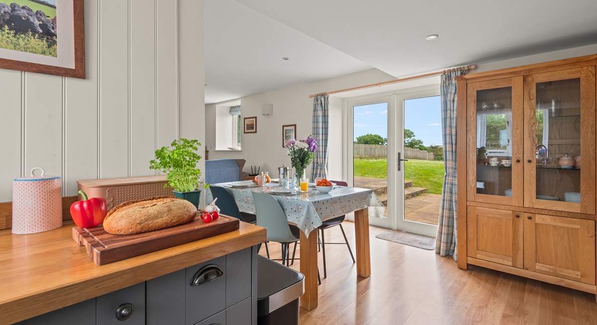 The kitchen and dining areas open out onto your patio.