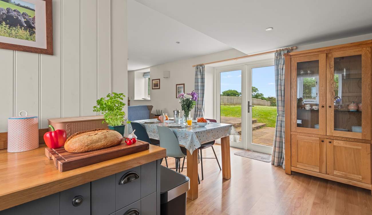 The kitchen and dining areas open out onto your patio.