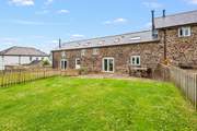 Ball games galore can be enjoyed in this fully enclosed lawn area. The perfect environment for children and dogs to let off steam.