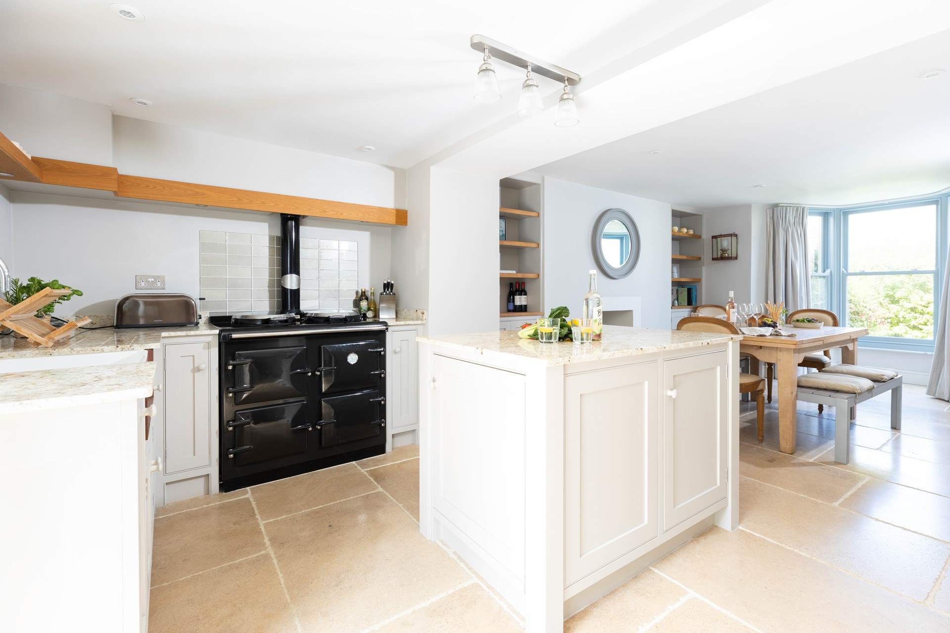 The gorgeous kitchen has an Aga which adds to the cosiness of this lovely seaside retreat.