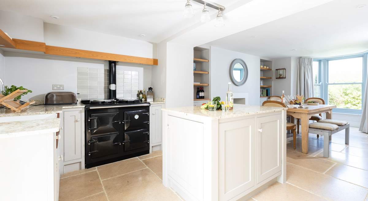 The gorgeous kitchen has an Aga which adds to the cosiness of this lovely seaside retreat.