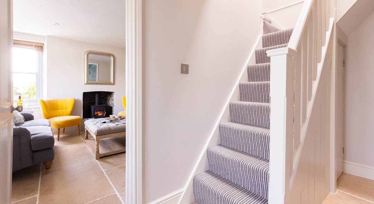 The steep cottage staircase leads up the bedrooms.