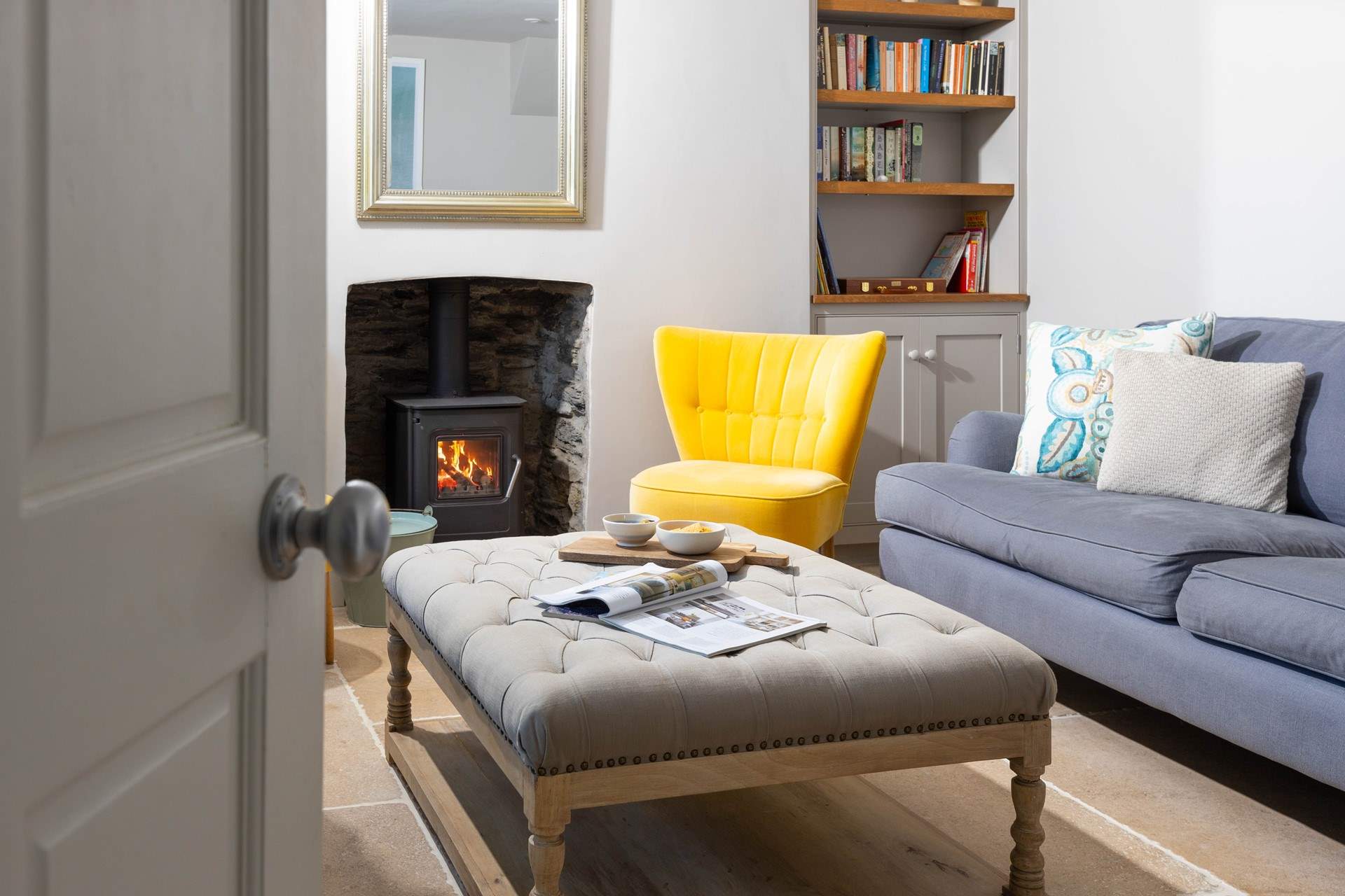 Step inside the sitting-room to relax in front of the cosy wood-burner.