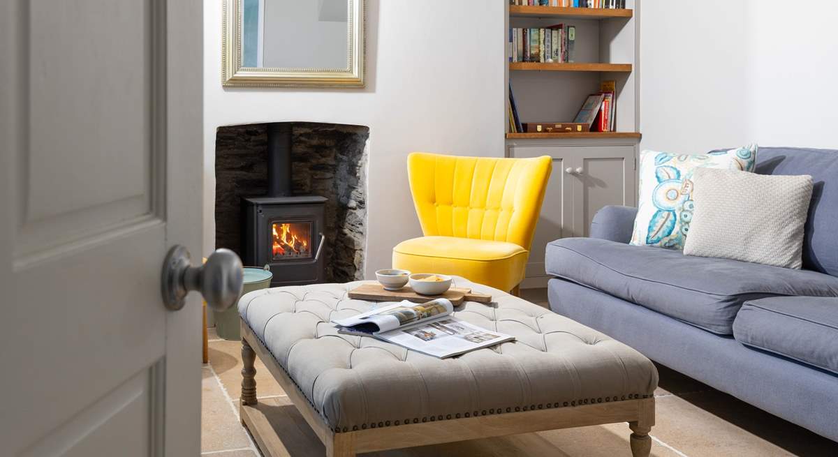 Step inside the sitting-room to relax in front of the cosy wood-burner.