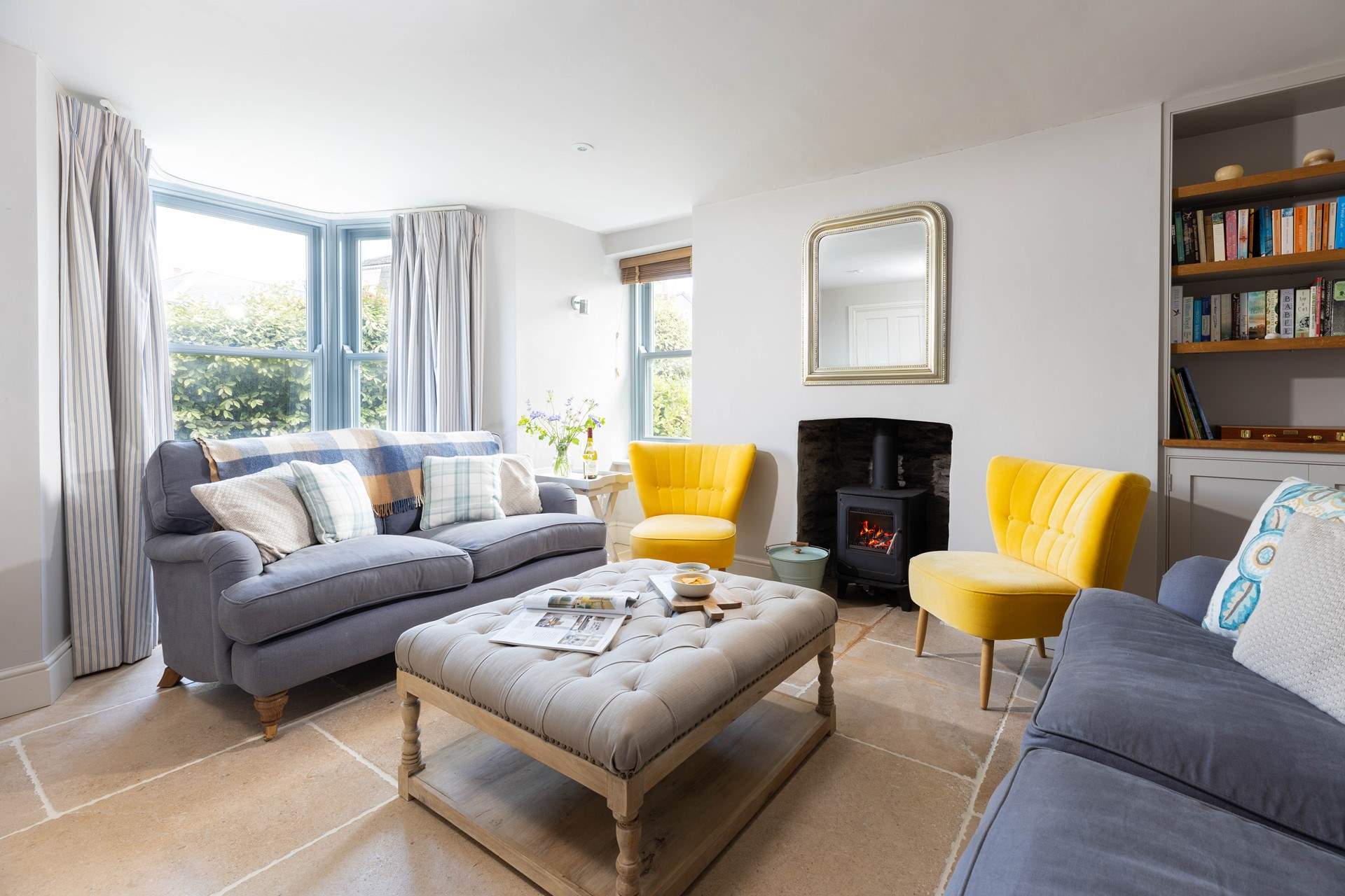 The sitting-room is beautifully furnished with a cosy log-burner for those colder evenings.