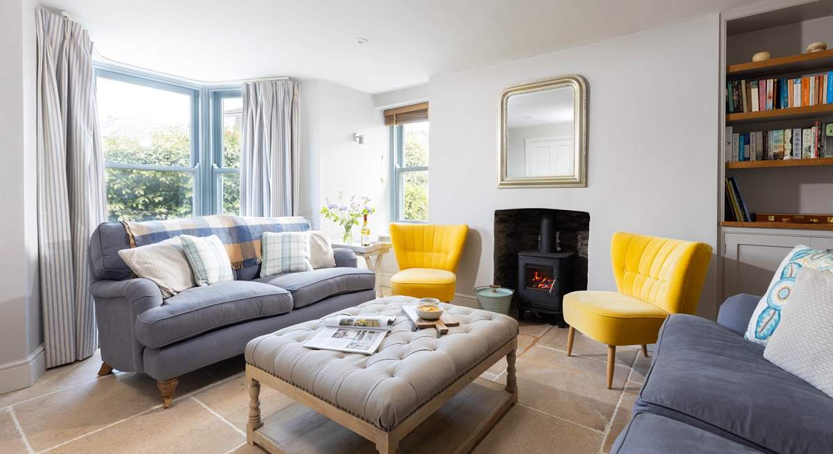 The sitting-room is beautifully furnished with a cosy log-burner for those colder evenings.