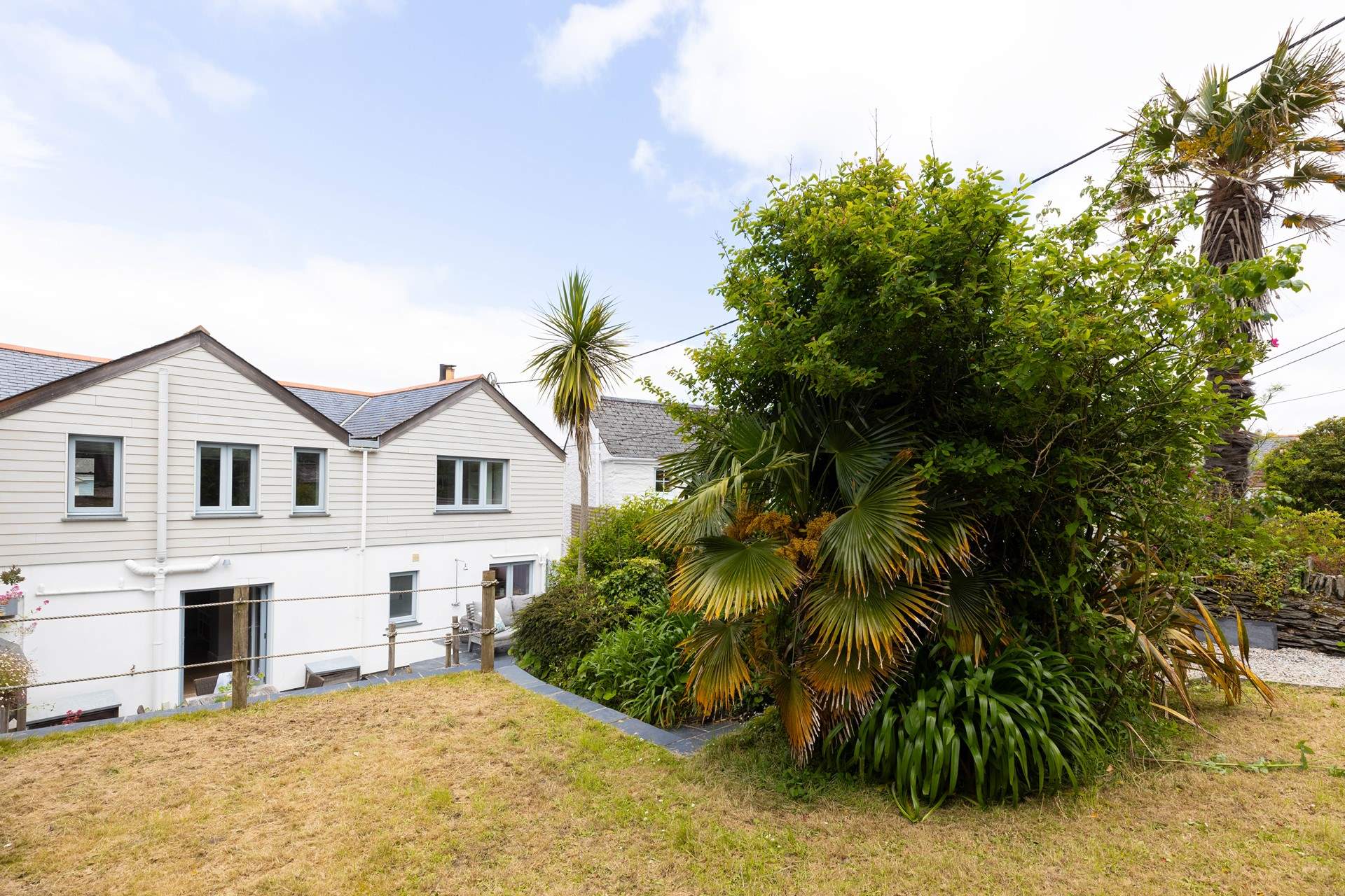 The steps from the patio lead up to even more garden space.