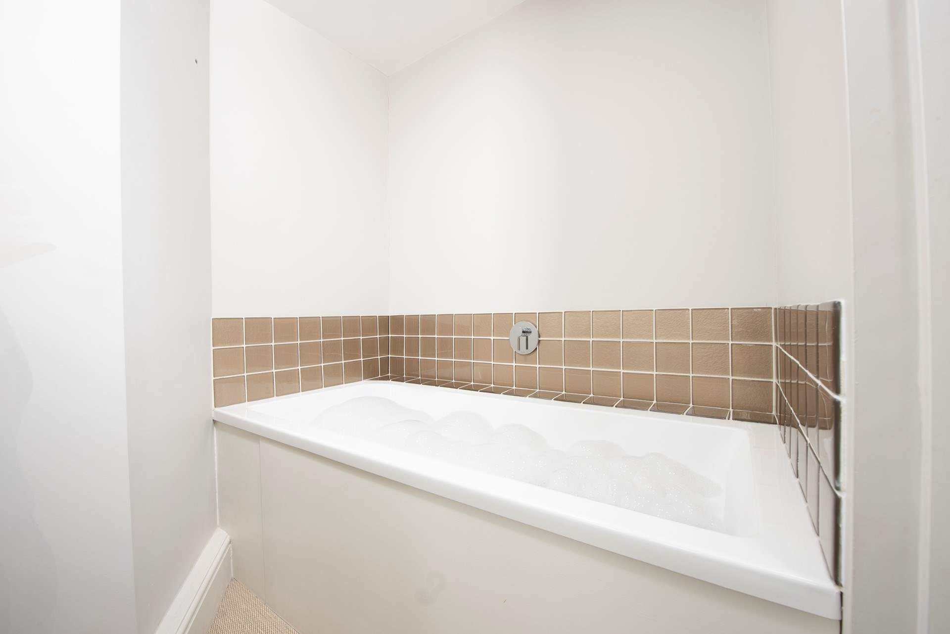 Enjoy a long soak in the bathroom after a busy day of exploring. 