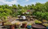 Sit back and relax on the decking in the glorious garden. - Thumbnail Image