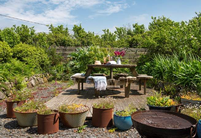 Sit back and relax on the decking in the glorious garden.