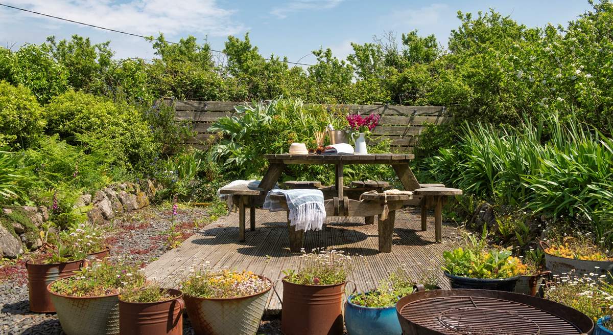 Sit back and relax on the decking in the glorious garden.