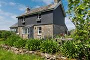 This beautiful cottage is surrounded by the lush Cornish countryside.