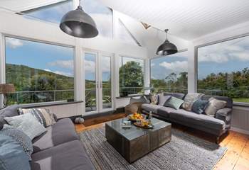 A spacious stunning sun-room with doors opening onto the terrace... a perfect place to relax.