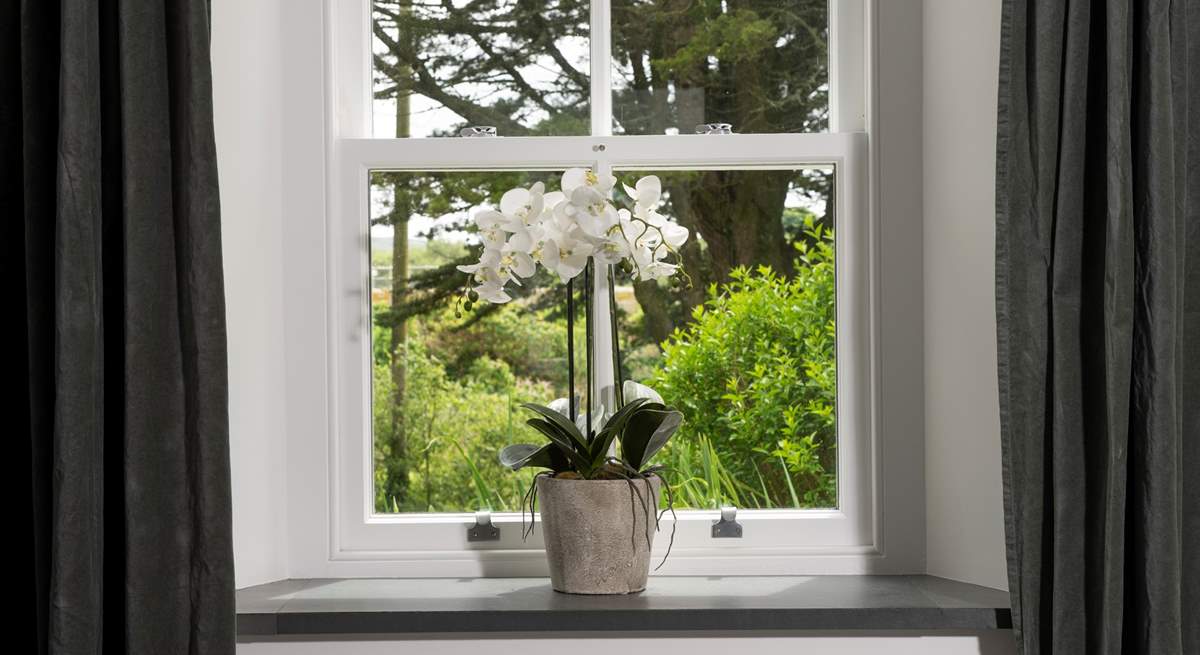 The cottage has wraparound gardens, viewed from every window.