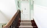 From the hallway climb the stairs to the entrance door. - Thumbnail Image