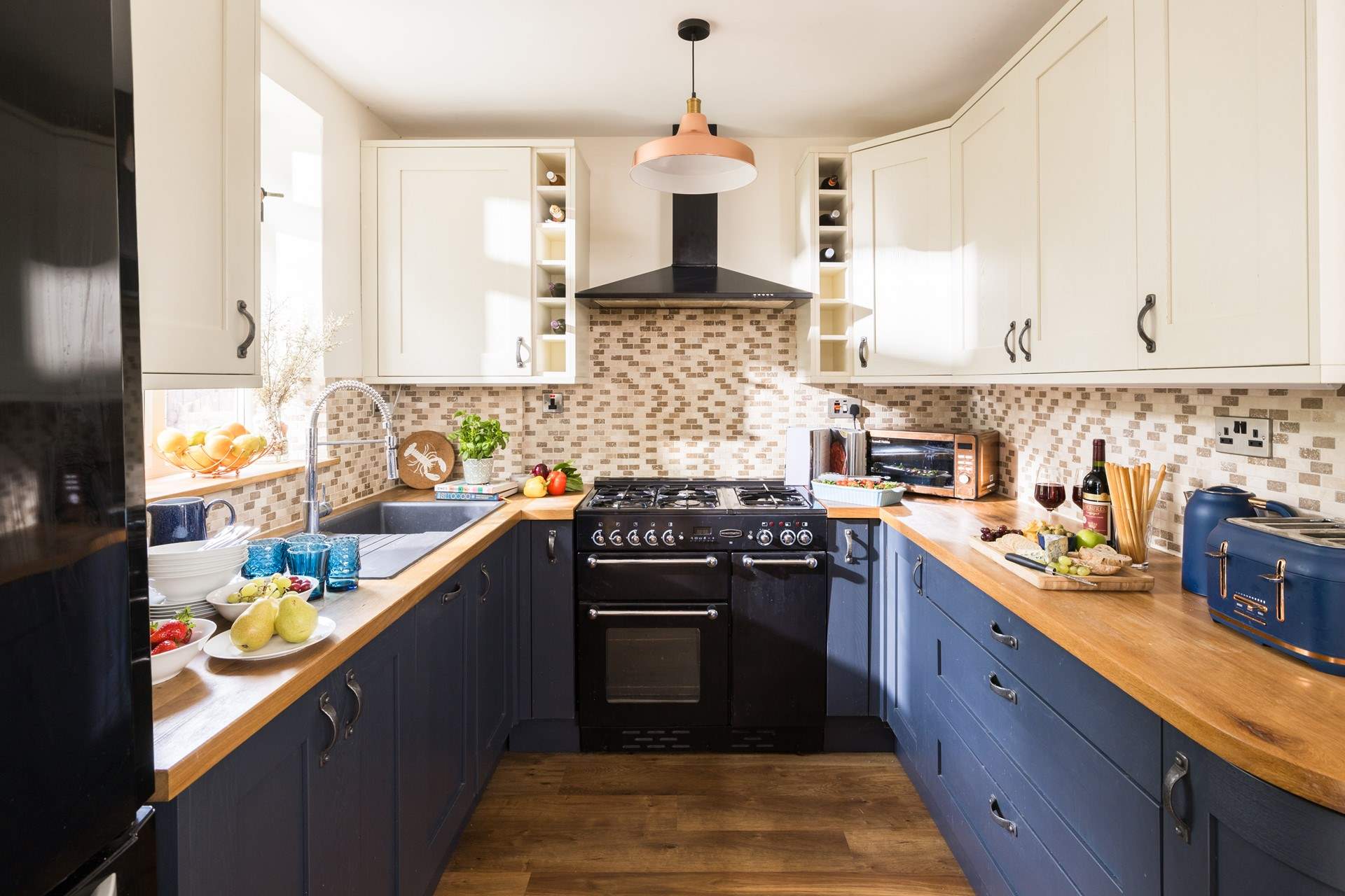 The cook will just love this pretty kitchen.