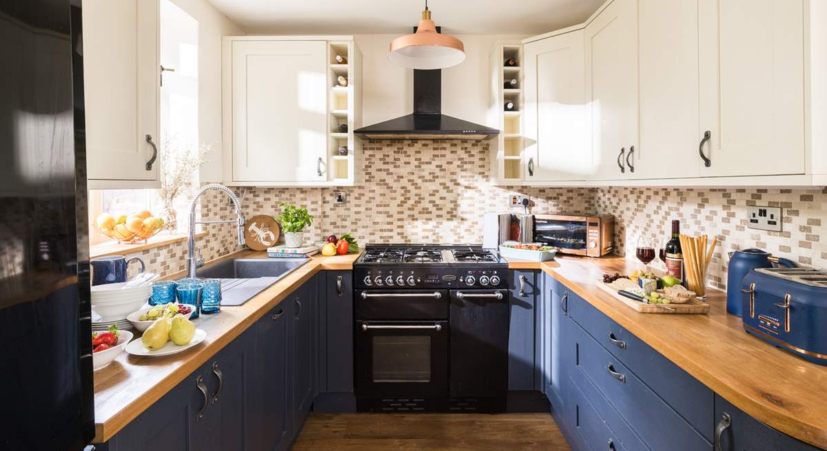 The cook will just love this pretty kitchen.