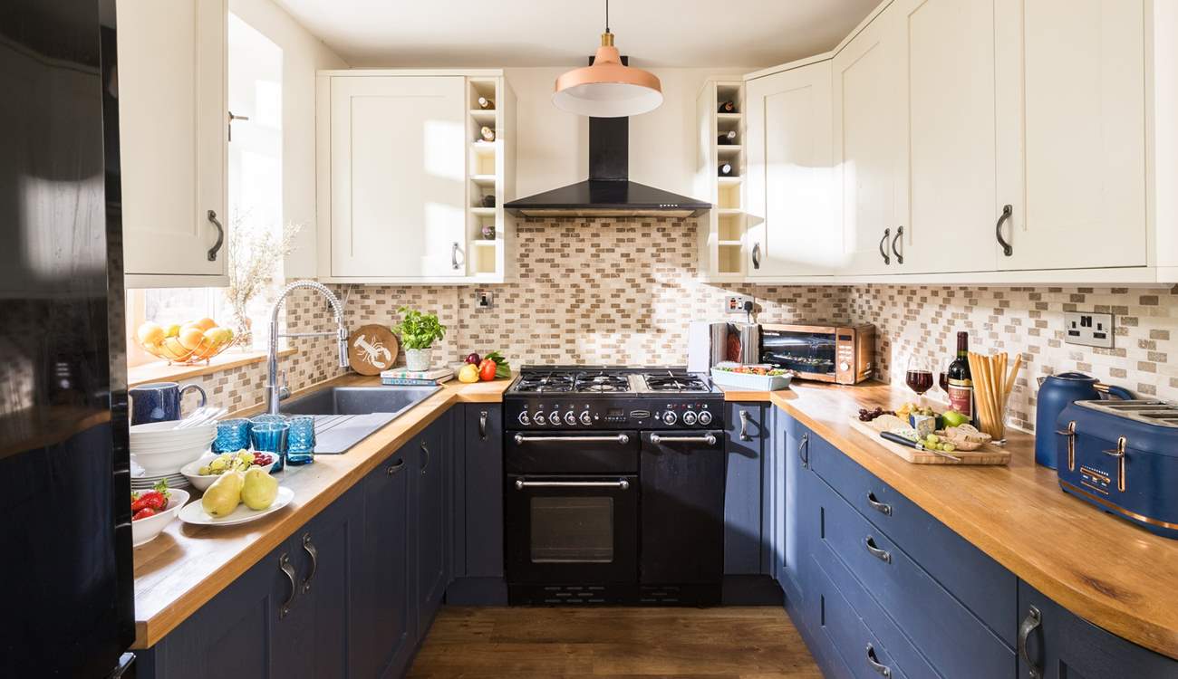 The cook will just love this pretty kitchen.