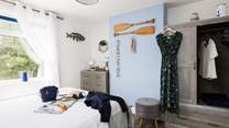 Getting ready for a fun day out in this sunny bedroom.