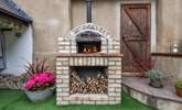 Try your hand at making your own wood-fired pizza. The younger members of the group will love this. - Thumbnail Image