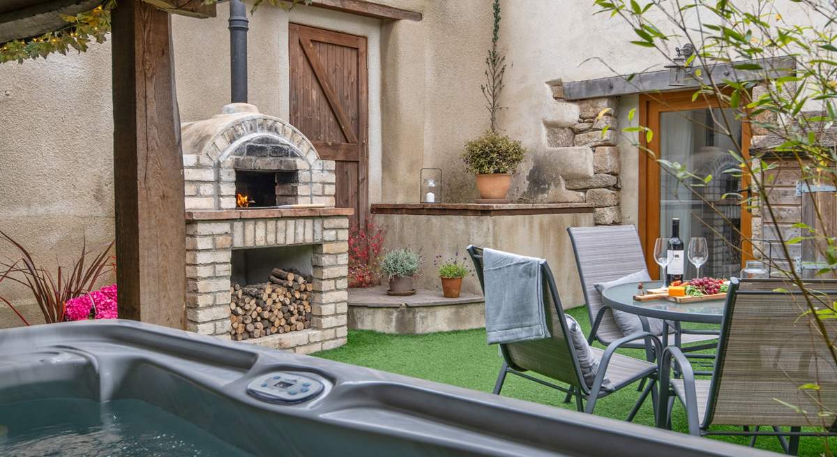 Your fabulous secluded courtyard, fully equipped with hot tub and pizza oven.