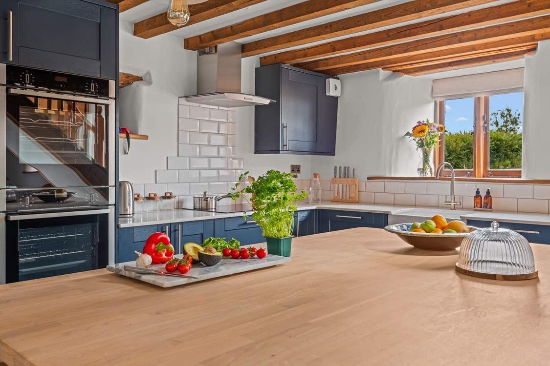 The fully equipped kitchen offers oodles of space to enjoy your favourite treats.