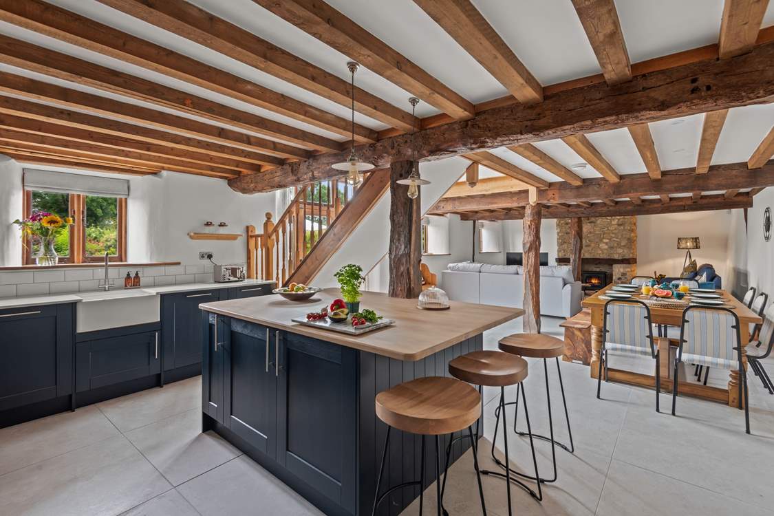 The open plan setting is perfectly designed for the whole party to dine, play and relax together.