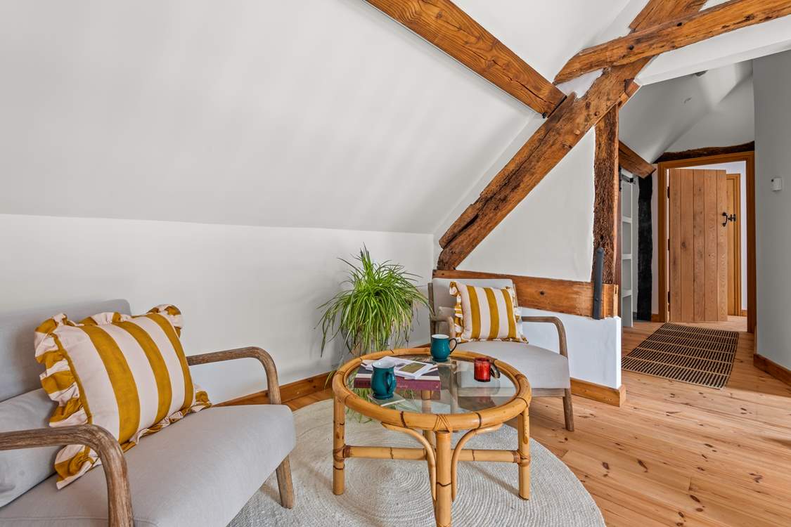The first floor landing provides a great spot to relax and enjoy a book or your morning coffee.