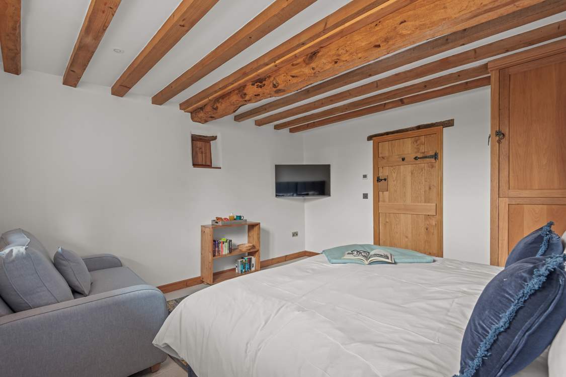Bedroom 1 is fully equipped with a comfy sofa and TV, making it the perfect space to retire to for some peace and quiet.