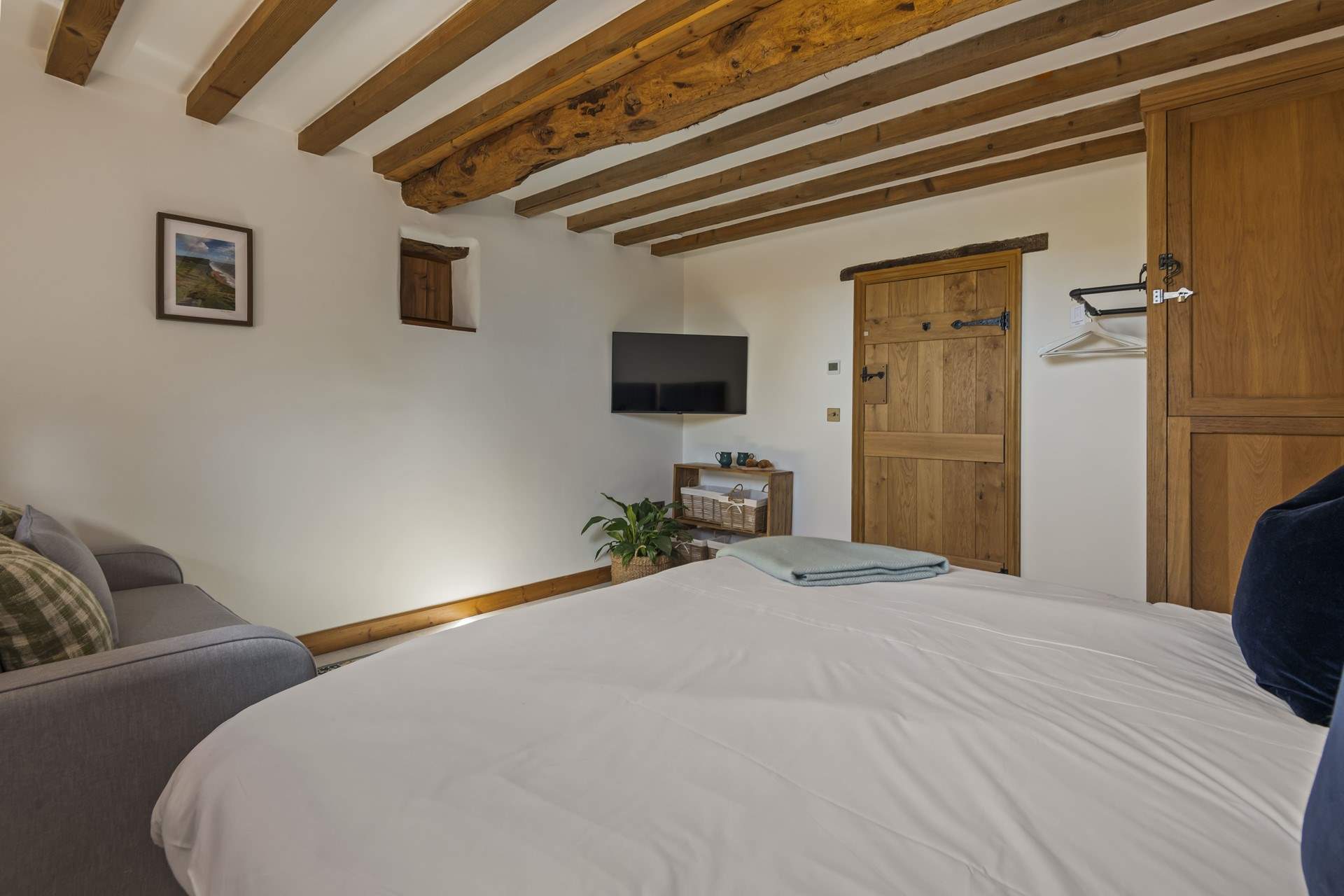 Bedroom 1 is fully equipped with a comfy sofa and TV, making it the perfect space to retire to for some peace and quiet.