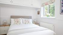 A cosy bedroom overlooking the garden.