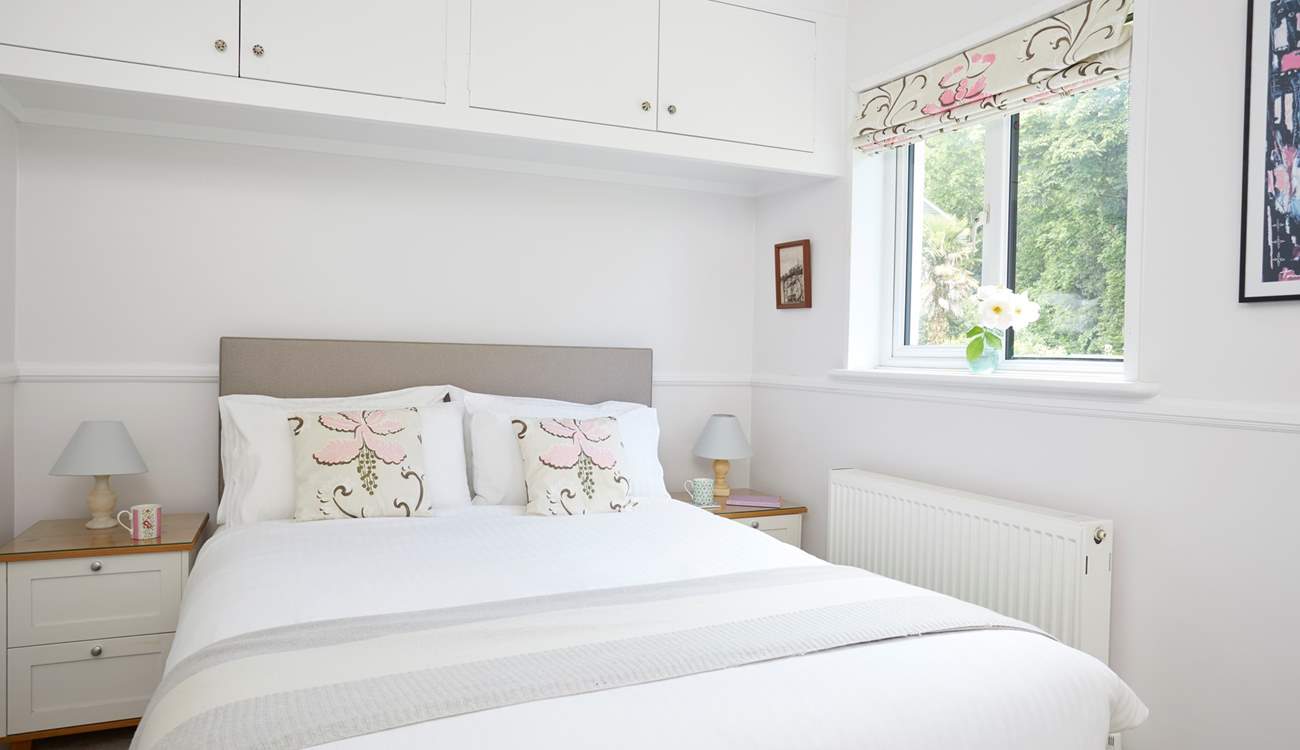 A cosy bedroom overlooking the garden.