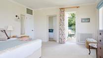The final bedroom has a balcony overlooking the garden.
