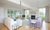 The light and airy living space awaits and in the cooler months curl up in front of the fire. - Thumbnail Image