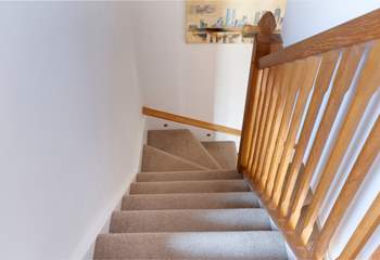 Stairs lead to the bedroom and shower-room.