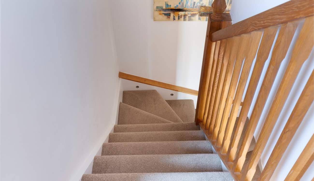Stairs lead to the bedroom and shower-room.