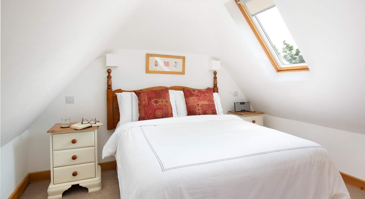 The Velux windows make the bedroom light and bright.