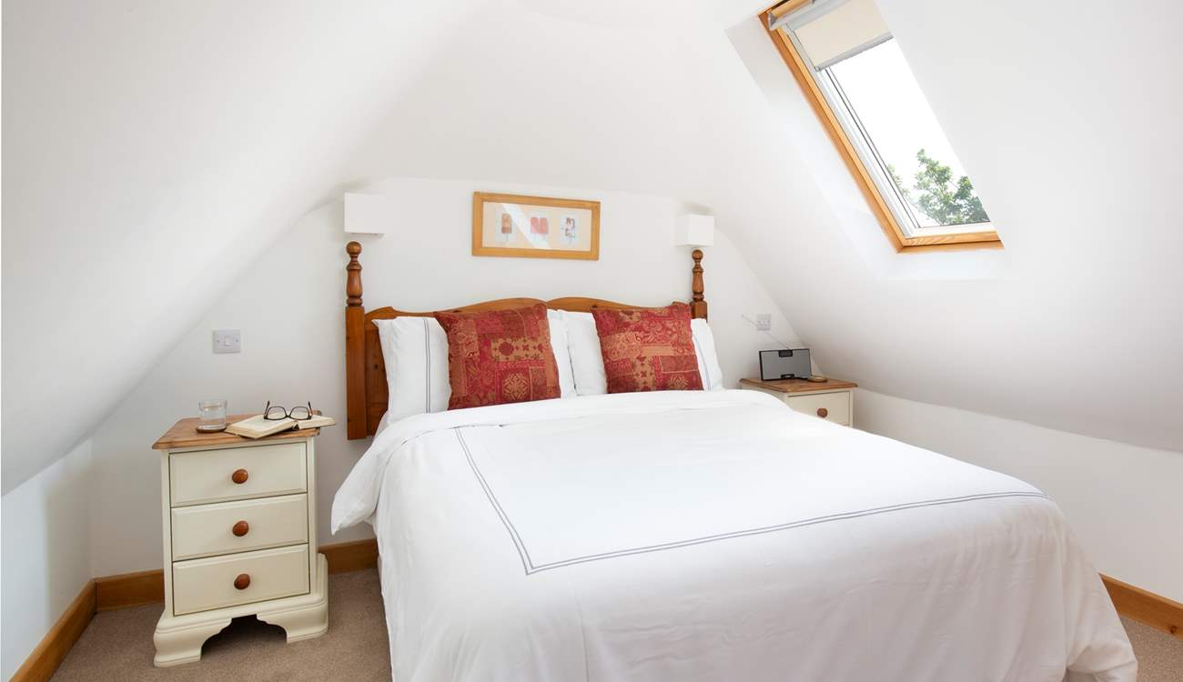 The Velux windows make the bedroom light and bright.