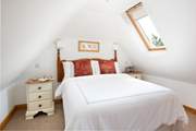 The Velux windows make the bedroom light and bright.