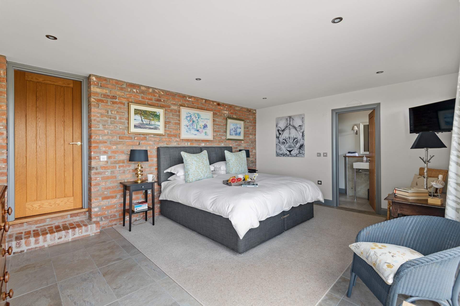 Bedroom 1 is spacious and airy. With a TV to complement those lazy mornings in bed. Please be aware of the step down into bedroom 1.